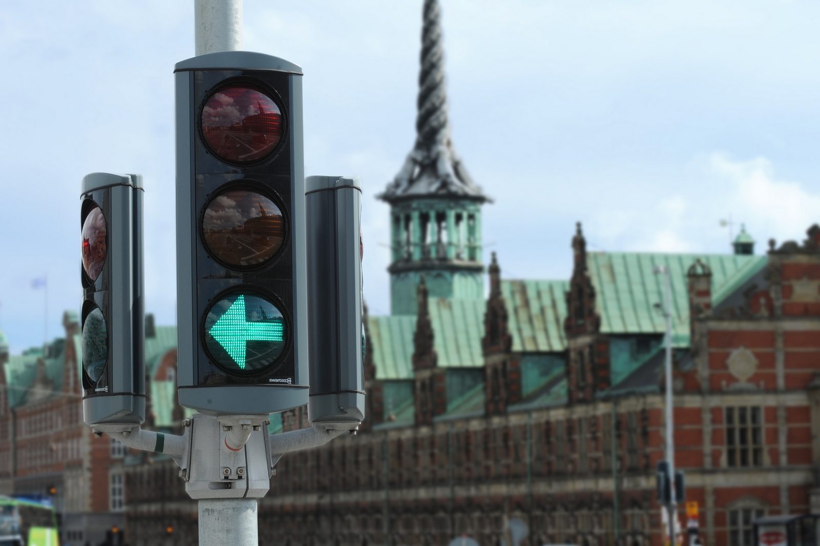 Traffic light in front of a historic city building
