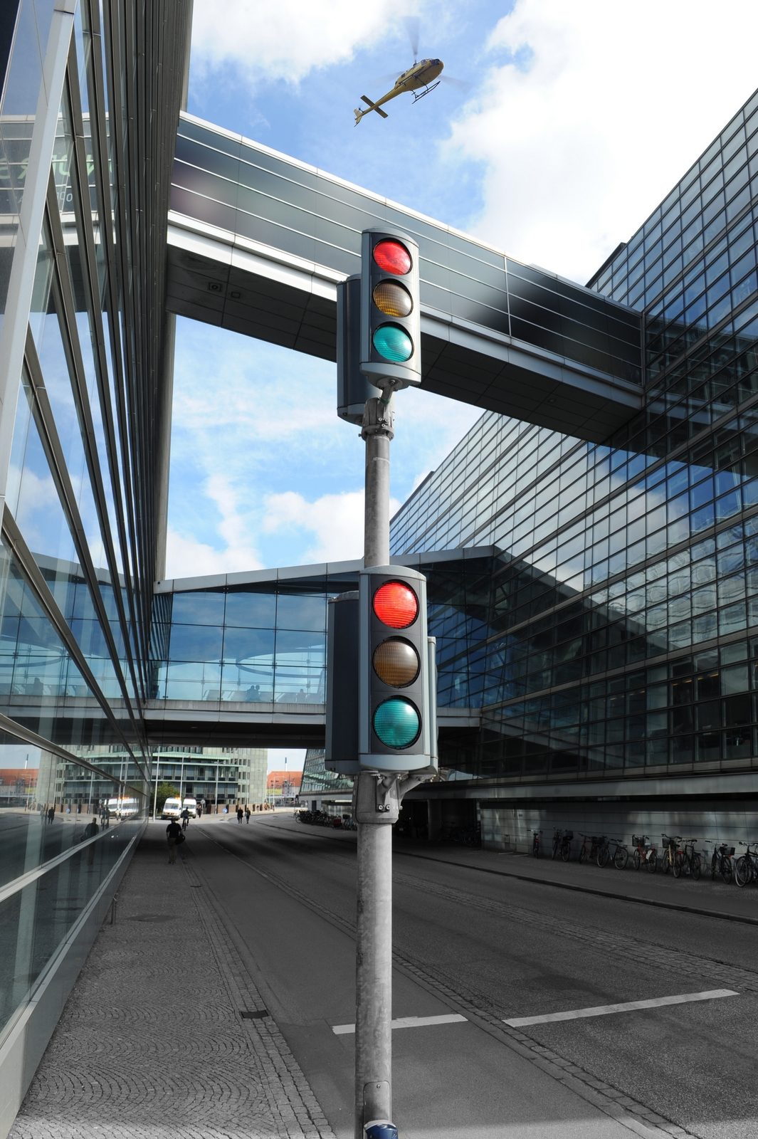 Traffic light at a modern glass building
